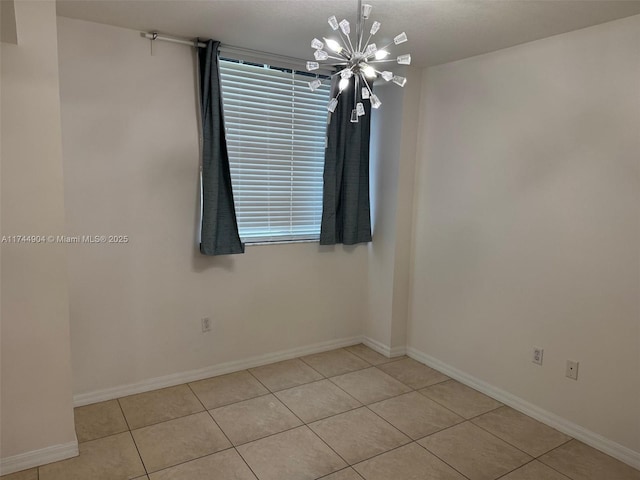 3530 SW 22nd St Unit 706, Miami, FL 33145 - spare room featuring light tile patterned floors, baseboards, and an inviting chandelier