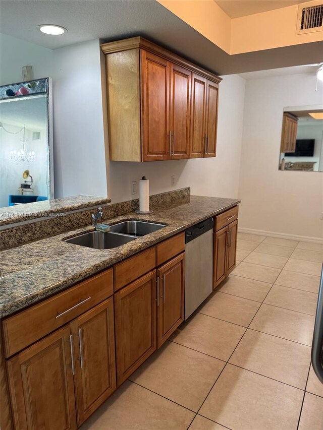 3530 SW 22nd St Unit 706, Miami, FL 33145 - kitchen with brown cabinets, light tile patterned floors, visible vents, stainless steel dishwasher, and a sink