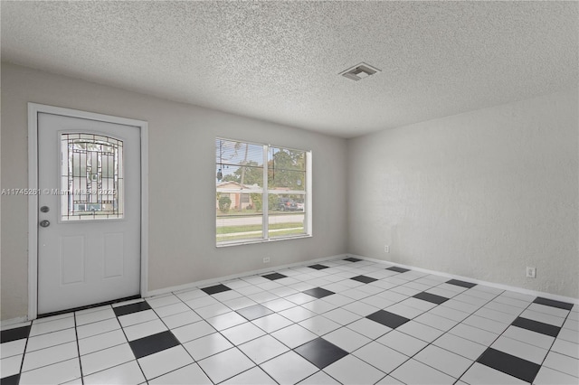 entrance foyer with a textured ceiling