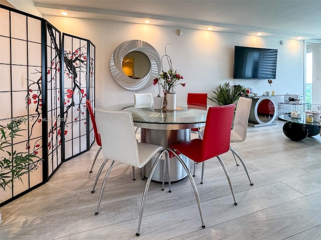 dining space featuring light wood-style floors and recessed lighting