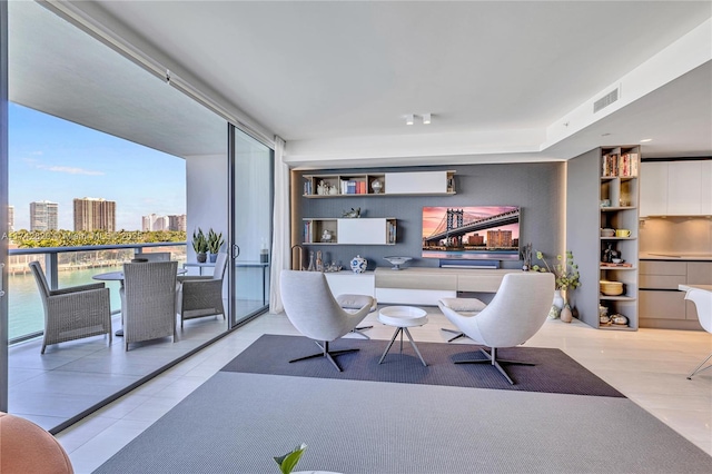 office area with a view of city, visible vents, and wood finished floors