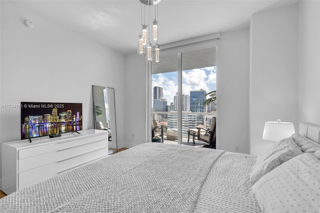 bedroom featuring baseboards and wood finished floors