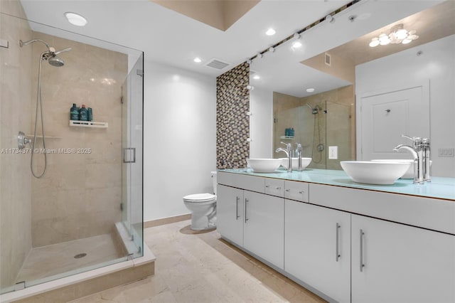 315 NE 3rd Ave Unit 1804, Fort Lauderdale, FL 33301 - bathroom with a shower stall, double vanity, visible vents, and a sink