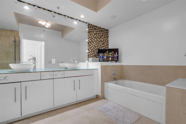 315 NE 3rd Ave Unit 1804, Fort Lauderdale, FL 33301 - full bathroom with a shower stall, double vanity, a bath, and a sink