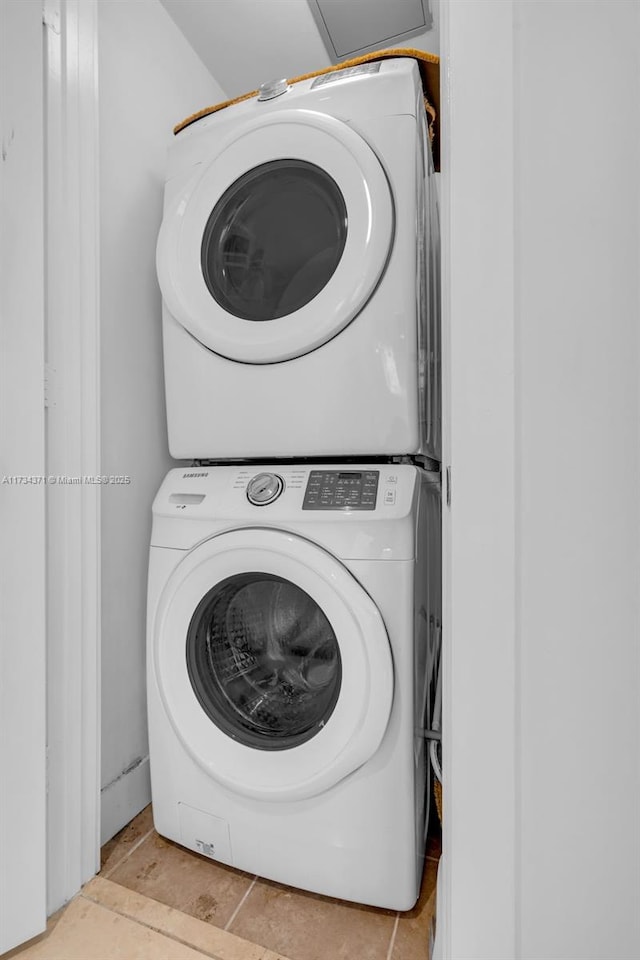 315 NE 3rd Ave Unit 1804, Fort Lauderdale, FL 33301 - clothes washing area featuring stacked washer / drying machine and laundry area