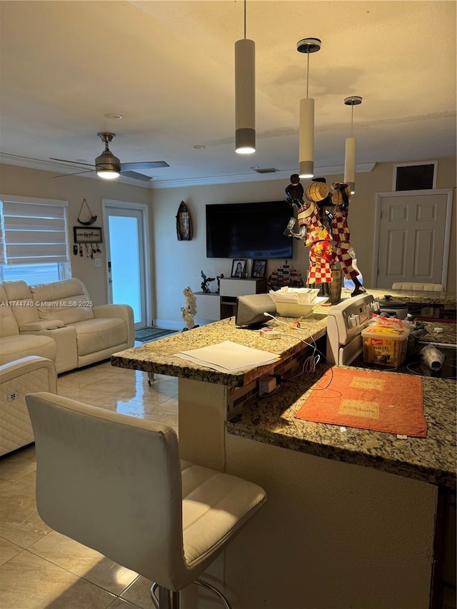 living room featuring light tile patterned floors and ceiling fan