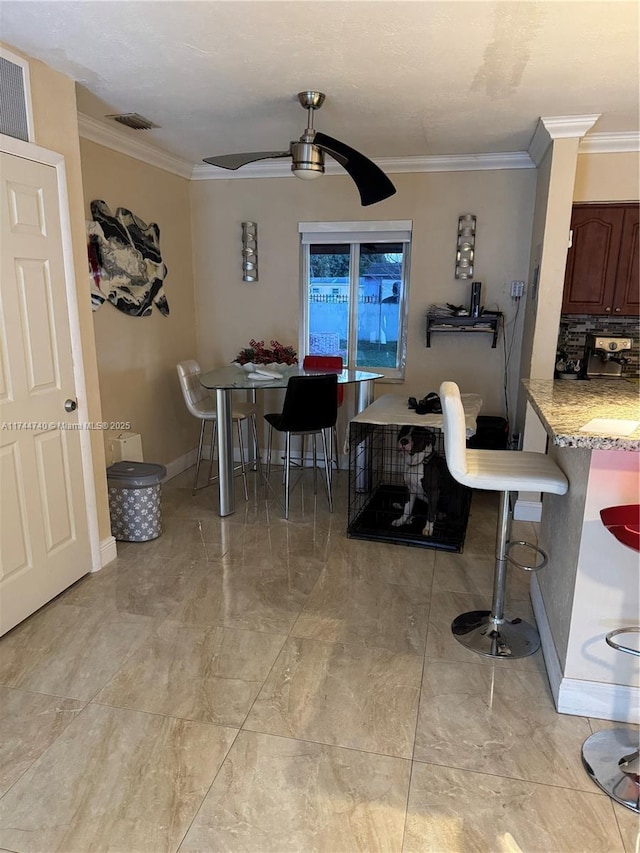 2770 NW 164th Ter, Miami Gardens, FL 33054 - dining area with visible vents, baseboards, crown molding, and a ceiling fan