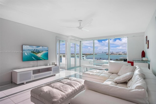 living room featuring light tile patterned floors and ceiling fan