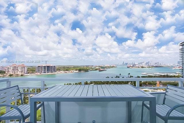 view of pool featuring a water view