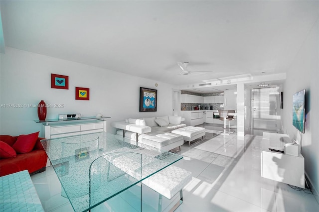 tiled living room featuring ceiling fan