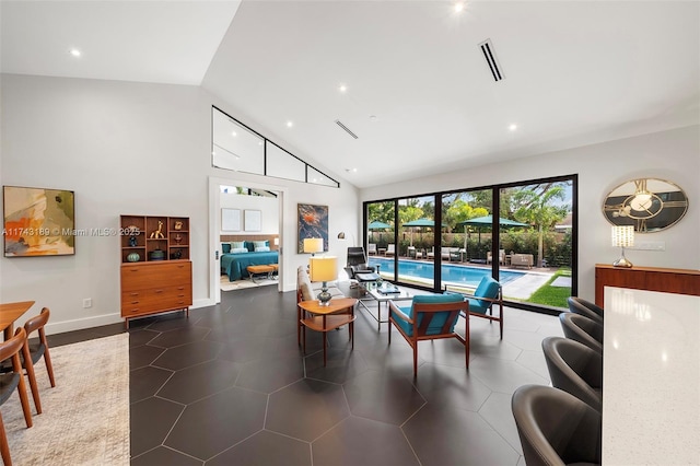 living area with baseboards, visible vents, high vaulted ceiling, and recessed lighting