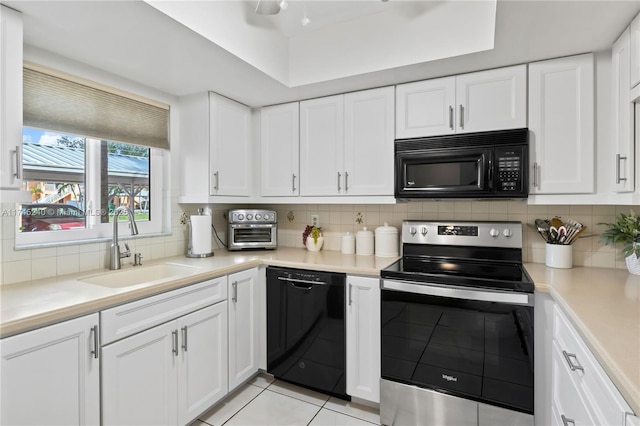 kitchen with white cabinets and black appliances