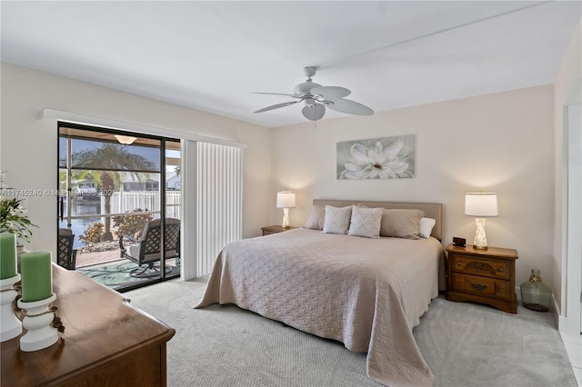 bedroom featuring ceiling fan, light colored carpet, and access to outside