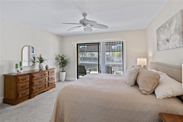 carpeted bedroom with access to outside and ceiling fan