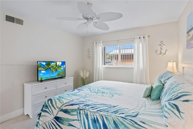 bedroom featuring light colored carpet and ceiling fan