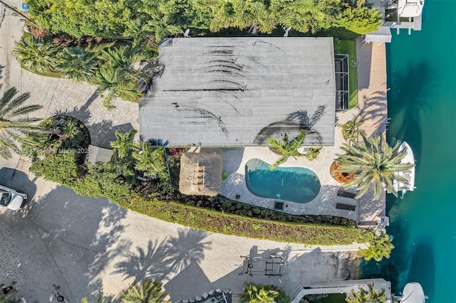 birds eye view of property with a water view