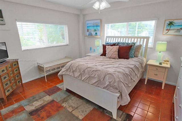 tiled bedroom featuring ceiling fan