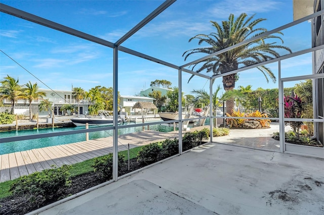 view of swimming pool with a lanai and a boat dock