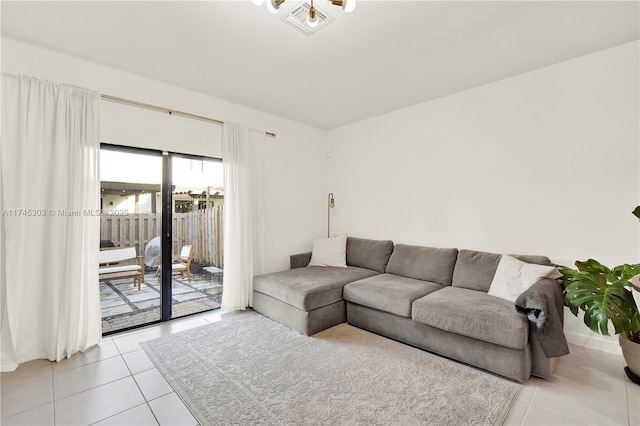 living room with light tile patterned floors and visible vents
