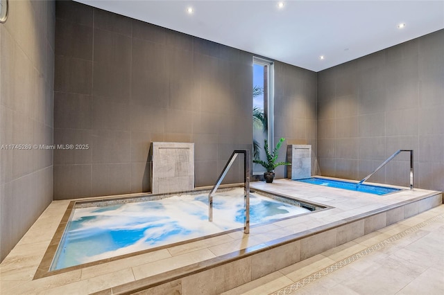 view of pool with an indoor in ground hot tub