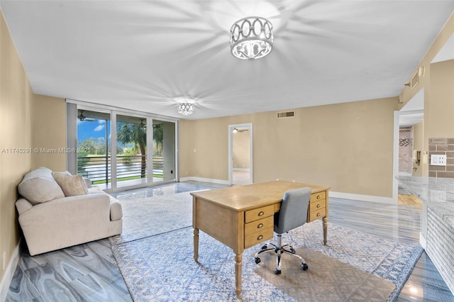 office area featuring floor to ceiling windows