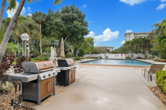 view of pool featuring a patio area