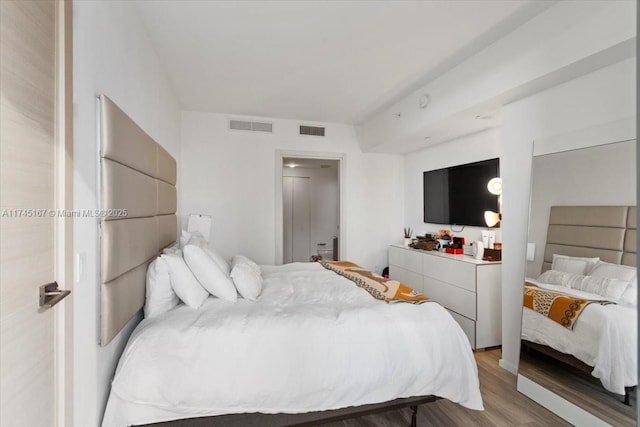 bedroom with light wood-type flooring