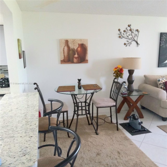 dining area with tile patterned floors