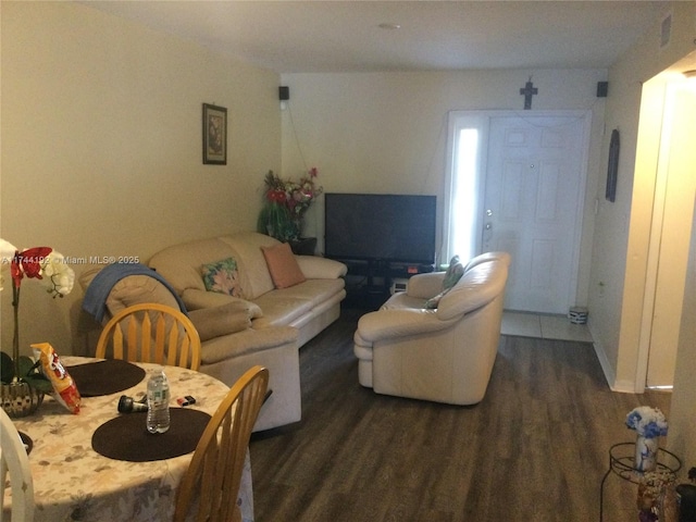 living room with dark hardwood / wood-style flooring