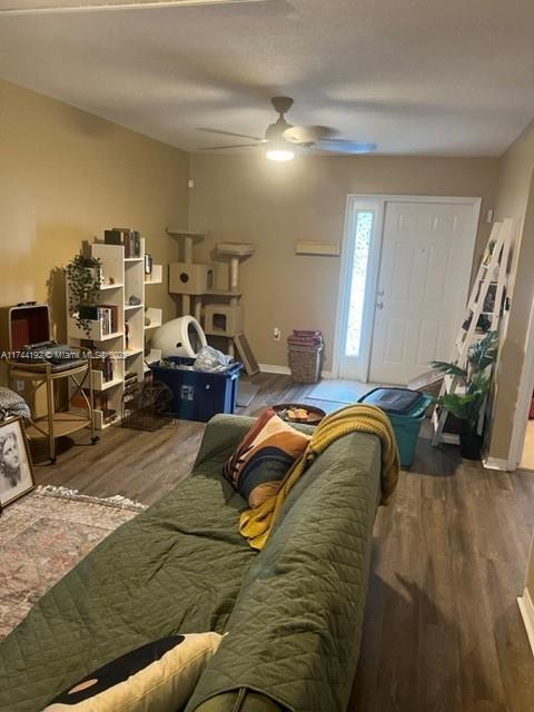 bedroom featuring hardwood / wood-style floors and ceiling fan