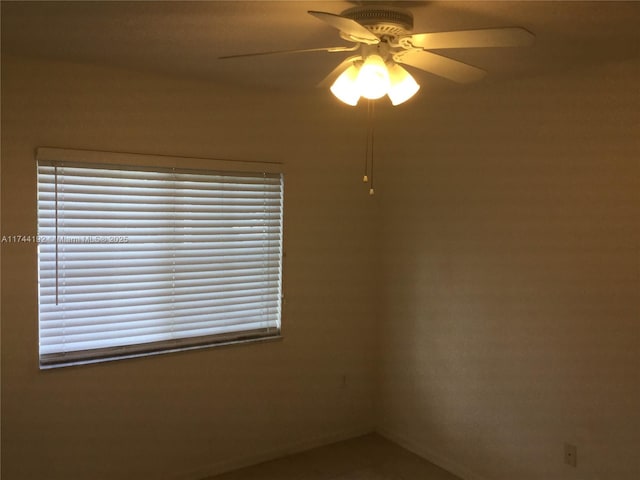 unfurnished room with ceiling fan