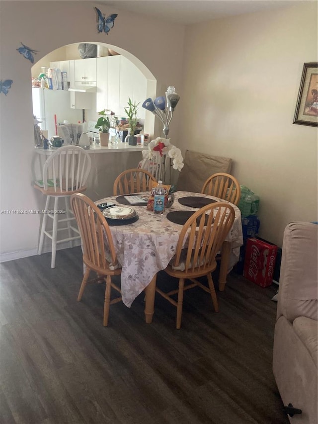 dining space featuring dark hardwood / wood-style floors