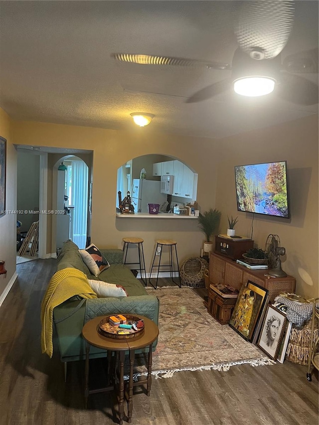 living room with dark hardwood / wood-style floors