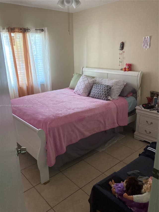 bedroom with light tile patterned flooring