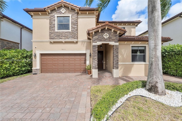 mediterranean / spanish house featuring a garage