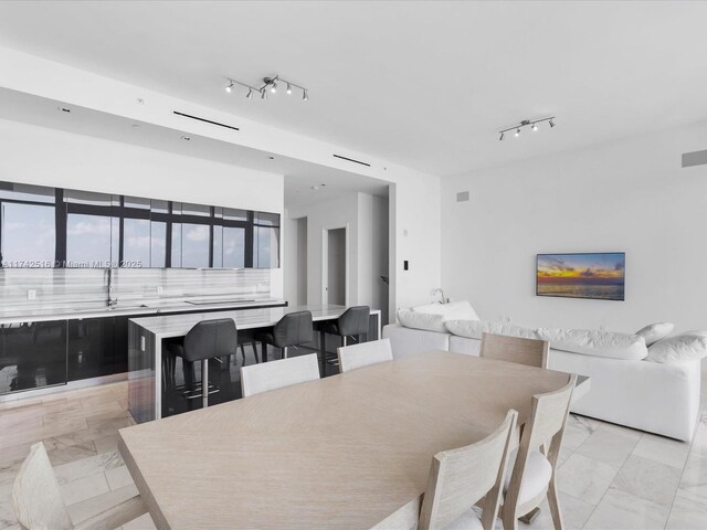 1451 Brickell Ave Unit 5101, Miami, FL 33131 - dining space featuring light marble finish floors and track lighting