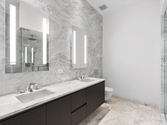 1451 Brickell Ave Unit 5101, Miami, FL 33131 - full bath featuring double vanity, a marble finish shower, and marble finish flooring
