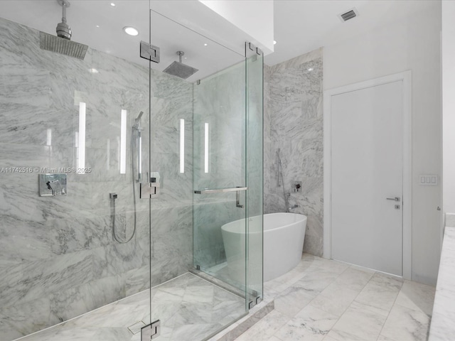 1451 Brickell Ave Unit 5101, Miami, FL 33131 - full bath featuring a marble finish shower, a freestanding bath, marble finish floors, and recessed lighting