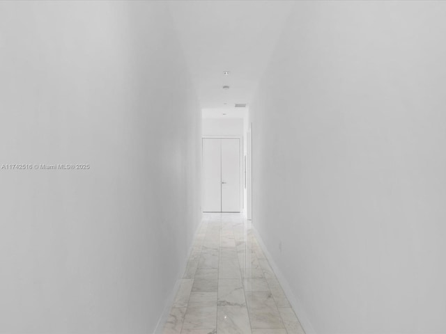 1451 Brickell Ave Unit 5101, Miami, FL 33131 - hallway with light marble finish flooring and baseboards