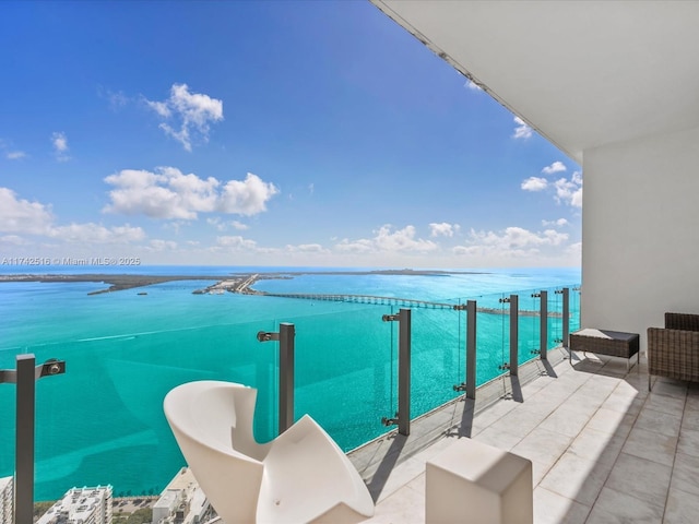 balcony featuring a water view