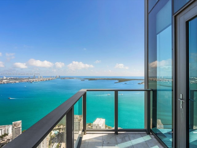 balcony featuring a water view