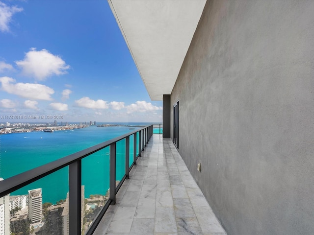 balcony featuring a water view