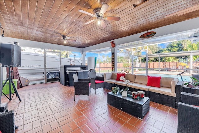 view of patio / terrace featuring an outdoor living space, a lanai, a pool, and ceiling fan