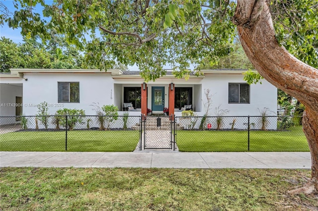 view of front of home with covered porch and a front yard