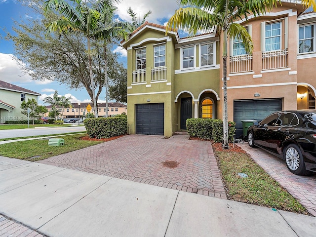 multi unit property featuring a garage