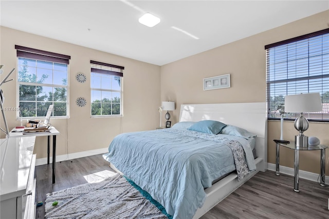 bedroom with hardwood / wood-style floors