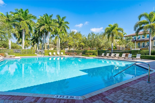 community pool featuring fence