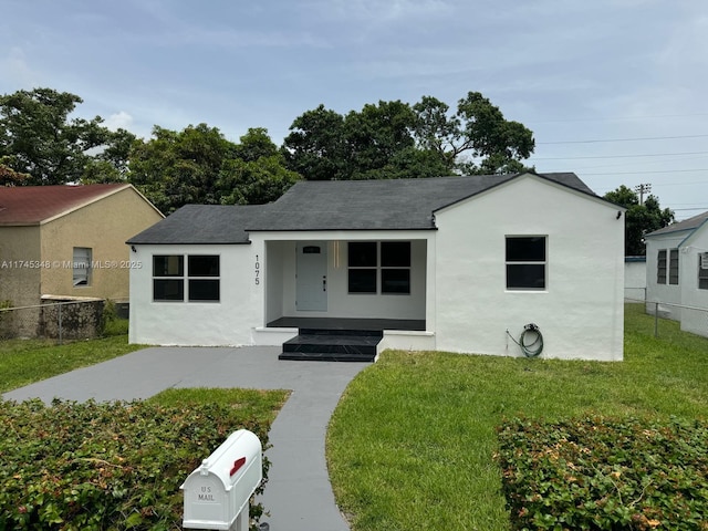 ranch-style house featuring a front lawn