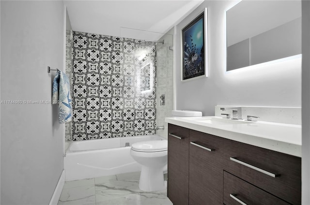 full bathroom with vanity, tiled shower / bath, and toilet