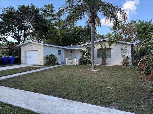 single story home with a garage and a front yard